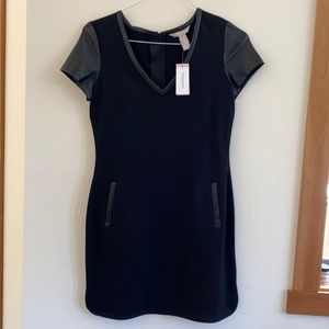 Vegan leather sleeved black dress